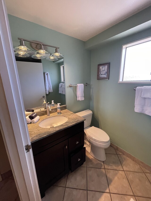 75-5719 Alii Dr Unit 409, Kailua-Kona, HI 96740 - half bath featuring vanity, toilet, and tile patterned floors