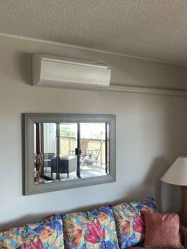 75-5719 Alii Dr Unit 409, Kailua-Kona, HI 96740 - detailed view of a wall unit AC and a textured ceiling