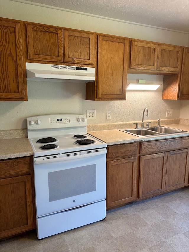 322 Ohai St Unit 16, Hilo, HI 96720 - kitchen with white electric range oven, a sink, under cabinet range hood, brown cabinetry, and light countertops