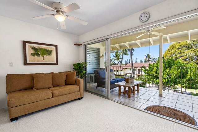 78-7054 Kamehameha Iii Rd Unit 504, Kailua-Kona, HI 96740 - tiled living area with a ceiling fan and carpet flooring