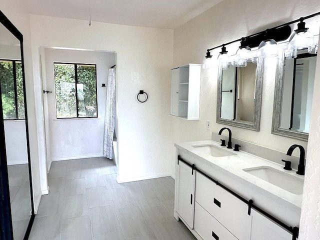 94-5826 Aouli Pl, Naalehu, HI 96772 - bathroom featuring double vanity, baseboards, and a shower with curtain