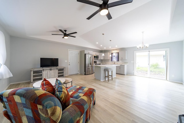 15-2806 Manalo St, Pahoa, HI 96778 - living area featuring lofted ceiling, a chandelier, a ceiling fan, light wood-style floors, and baseboards