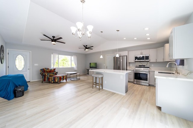 15-2806 Manalo St, Pahoa, HI 96778 - kitchen with stainless steel appliances, open floor plan, a sink, a ceiling fan, and a kitchen island