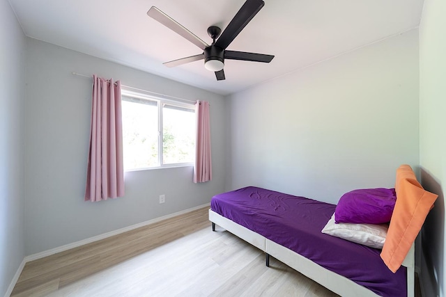 15-2806 Manalo St, Pahoa, HI 96778 - bedroom featuring wood finished floors, baseboards, and a ceiling fan
