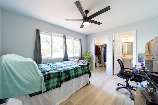 15-2806 Manalo St, Pahoa, HI 96778 - bedroom with a walk in closet, light wood-style flooring, a closet, ceiling fan, and a sink