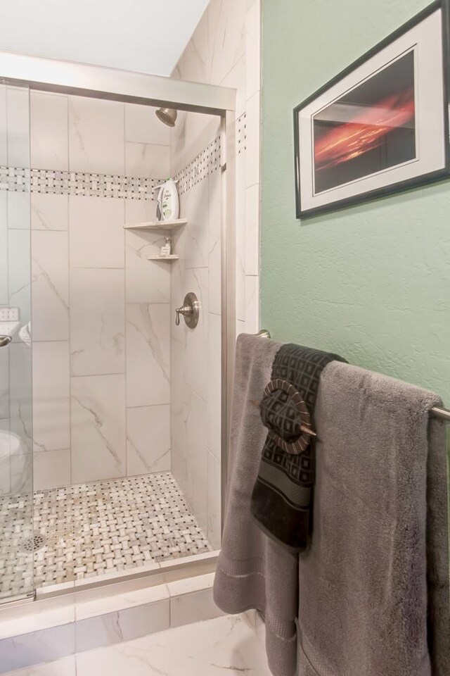 78-261 Manukai St Unit 3501, Kailua-Kona, HI 96740 - bathroom featuring a shower stall and marble finish flooring