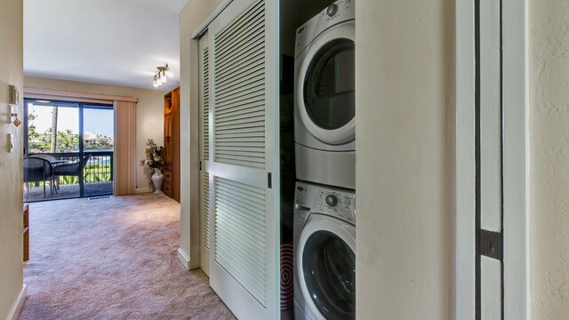 78-261 Manukai St Unit 3501, Kailua-Kona, HI 96740 - laundry room featuring estacked washer and dryer and carpet
