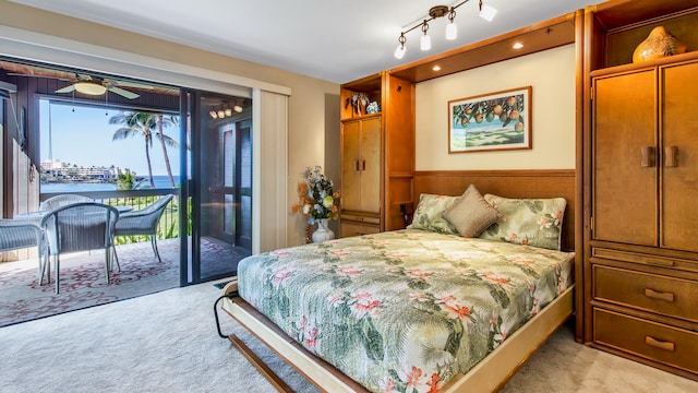 78-261 Manukai St Unit 3501, Kailua-Kona, HI 96740 - bedroom with light colored carpet, access to exterior, and a water view