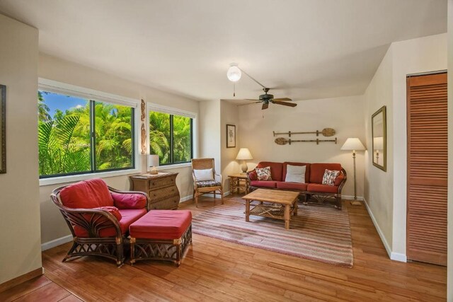 4800 Hanalei Plantation Rd Unit 9B, Princeville, HI 96722 - living room with wood finished floors, baseboards, and ceiling fan
