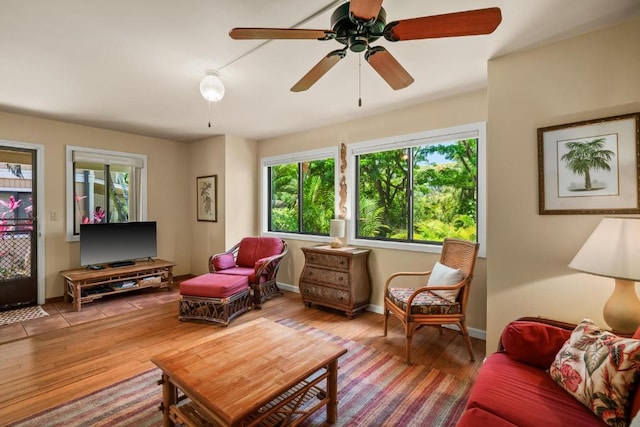 4800 Hanalei Plantation Rd Unit 9B, Princeville, HI 96722 - living room with healthy amount of natural light, ceiling fan, and wood finished floors