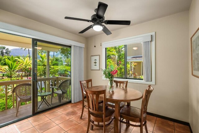 4800 Hanalei Plantation Rd Unit 9B, Princeville, HI 96722 - dining area with healthy amount of natural light, light tile patterned floors, ceiling fan, and baseboards
