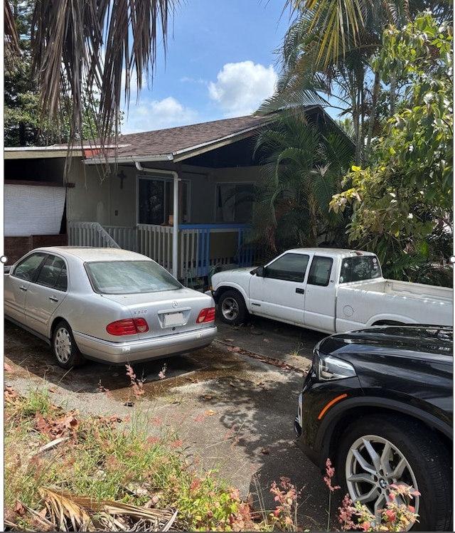 74-5087 Kumakani St, Kailua-Kona, HI 96740 - view of front facade with a shingled roof
