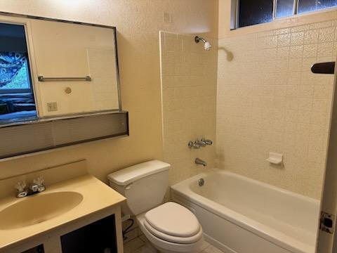 74-5087 Kumakani St, Kailua-Kona, HI 96740 - bathroom featuring toilet,  shower combination, and vanity