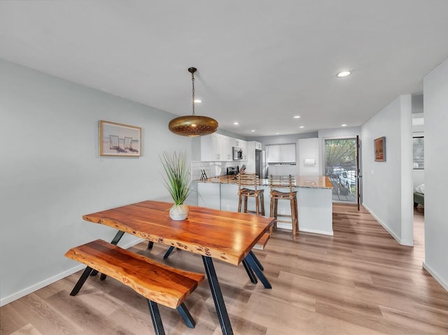 77-6585 Seaview Cir Unit 206, Kailua-Kona, HI 96740 - dining space with light wood-type flooring, baseboards, and recessed lighting