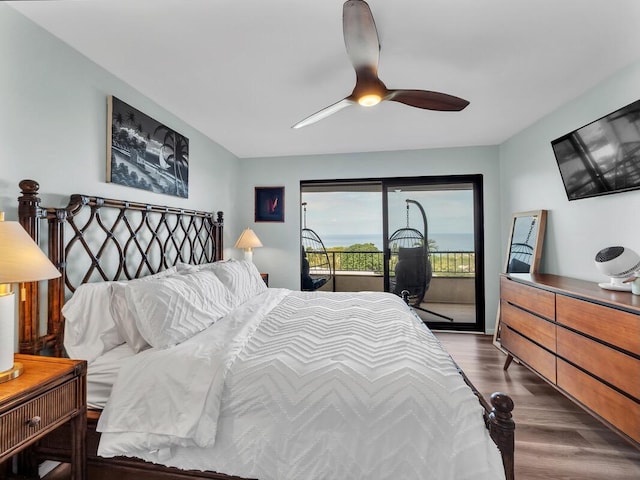 77-6585 Seaview Cir Unit 206, Kailua-Kona, HI 96740 - bedroom with access to exterior, dark wood-style flooring, and a ceiling fan