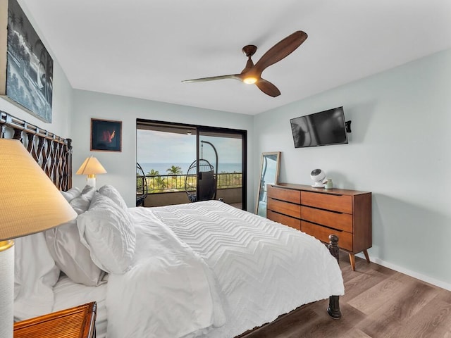 77-6585 Seaview Cir Unit 206, Kailua-Kona, HI 96740 - bedroom featuring access to outside, wood finished floors, baseboards, and a ceiling fan