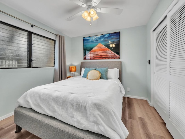 77-6585 Seaview Cir Unit 206, Kailua-Kona, HI 96740 - bedroom featuring a closet, wood finished floors, baseboards, and a ceiling fan