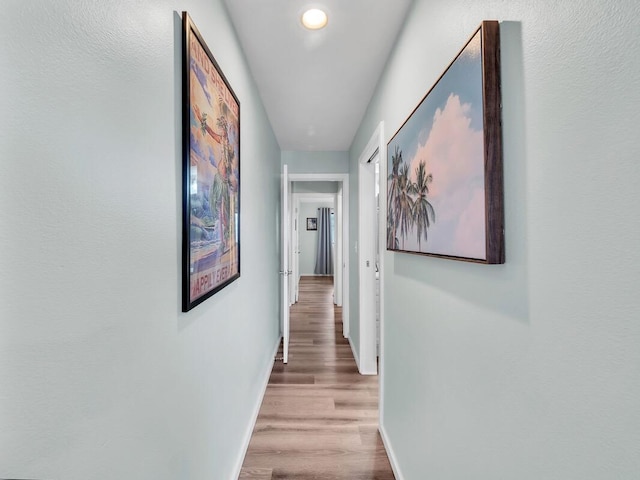 77-6585 Seaview Cir Unit 206, Kailua-Kona, HI 96740 - corridor featuring baseboards and wood finished floors