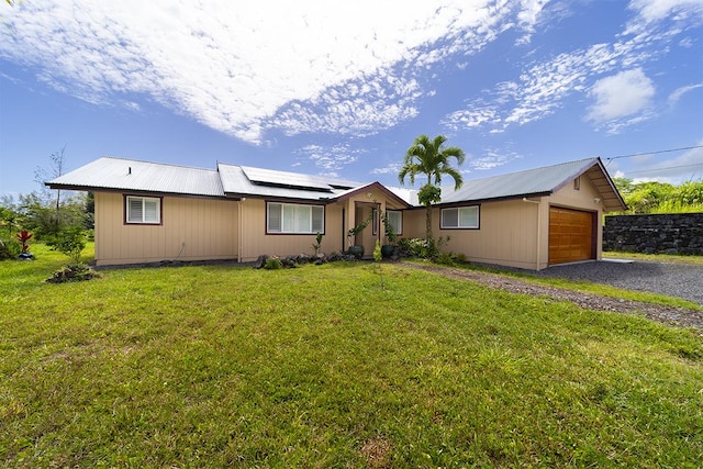 15-2063 18th Ave, Keaau, HI 96749 - ranch-style home featuring a metal roof, solar panels, and a front yard