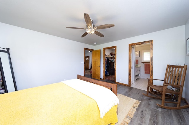15-2063 18th Ave, Keaau, HI 96749 - bedroom featuring wood finished floors, a closet, ensuite bath, a spacious closet, and ceiling fan