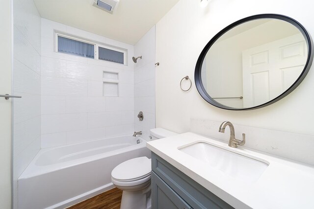 18-4259 Pszyk Rd, Mountain View, HI 96771 - bathroom featuring toilet, vanity, bathtub / shower combination, and wood finished floors