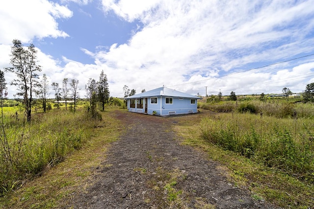 18-4259 Pszyk Rd, Mountain View, HI 96771 - view of front facade with dirt driveway