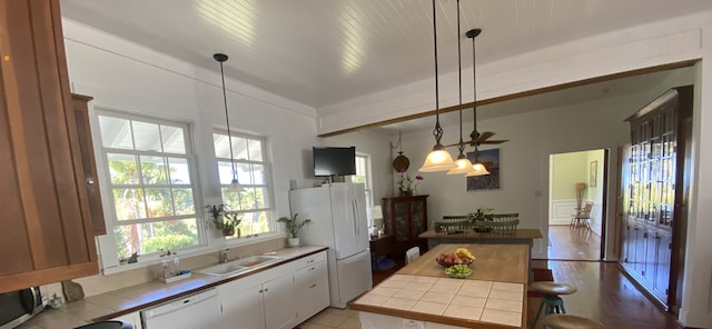 39-3383 Old Mamalahoa Hwy, Ookala, HI 96774 - kitchen featuring white appliances, tile countertops, a sink, and white cabinetry