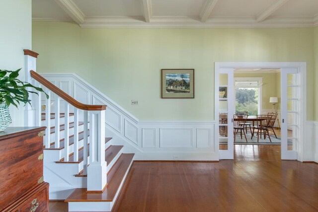 39-3383 Old Mamalahoa Hwy, Ookala, HI 96774 - stairway with wood-type flooring, ornamental molding, a wainscoted wall, and a decorative wall