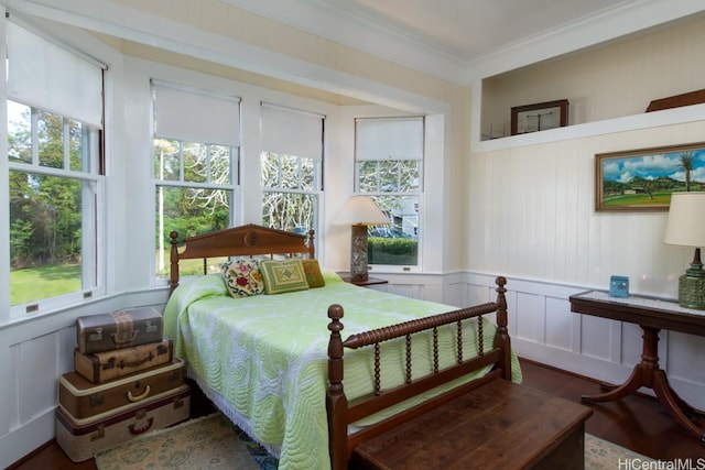 39-3383 Old Mamalahoa Hwy, Ookala, HI 96774 - bedroom featuring a decorative wall, multiple windows, crown molding, wood finished floors, and wainscoting