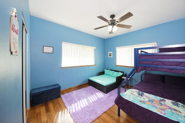 15-1697 7th Ave, Keaau, HI 96749 - bedroom with wood finished floors, a closet, and a ceiling fan