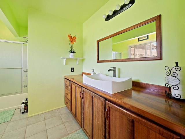 94-6543 Kamaoa Rd, Naalehu, HI 96772 - full bathroom with vanity, tile patterned flooring, combined bath / shower with glass door, and baseboards