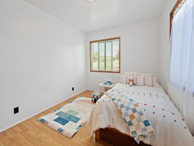 94-6543 Kamaoa Rd, Naalehu, HI 96772 - bedroom featuring wood finished floors and baseboards