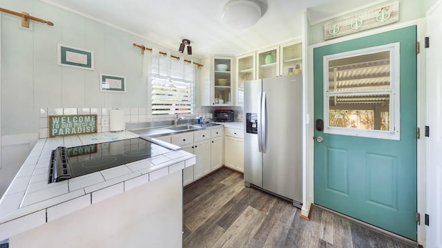 7990 Ulili Rd Unit A, Kekaha, HI 96752 - kitchen featuring stainless steel refrigerator with ice dispenser, tile counters, dark wood finished floors, a sink, and glass insert cabinets