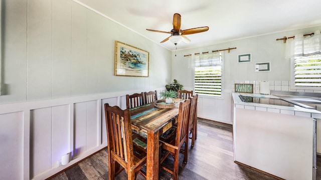 7990 Ulili Rd Unit A, Kekaha, HI 96752 - dining room featuring dark wood-type flooring, crown molding, a ceiling fan, and a decorative wall