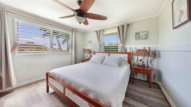 7990 Ulili Rd Unit A, Kekaha, HI 96752 - bedroom featuring wood finished floors, crown molding, a ceiling fan, and baseboards