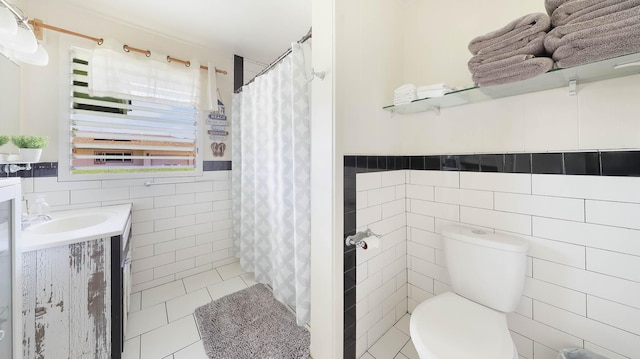 7990 Ulili Rd Unit A, Kekaha, HI 96752 - bathroom featuring tile walls, vanity, toilet, tile patterned flooring, and a shower with curtain