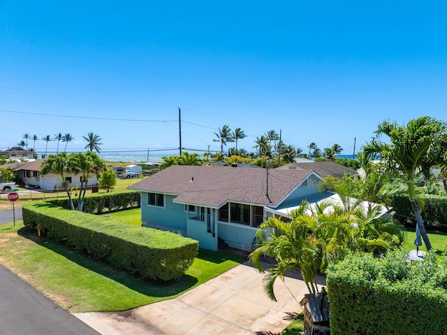 7990 Ulili Rd Unit A, Kekaha, HI 96752 - ranch-style house featuring roof with shingles and driveway