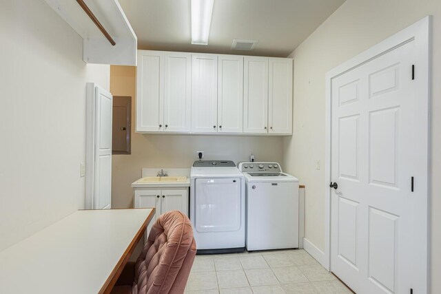 1187 Nohea St, Kalaheo, HI 96741 - washroom featuring washing machine and clothes dryer, cabinet space, and light tile patterned flooring