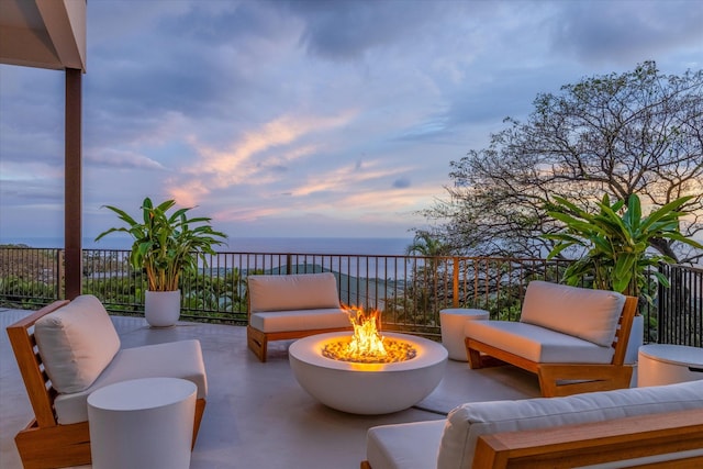 76-981 Aeo St, Kailua-Kona, HI 96740 - view of patio with an outdoor living space with a fire pit and a water view