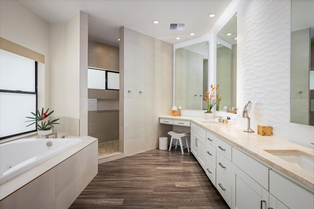 76-981 Aeo St, Kailua-Kona, HI 96740 - bathroom with a whirlpool tub, wood finished floors, double vanity, and plenty of natural light