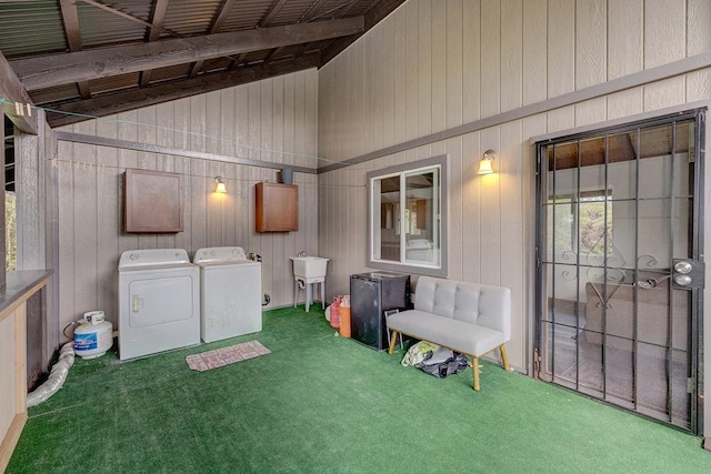 16-2159 Bamboo Dr, Pahoa, HI 96778 - laundry area featuring washing machine and dryer, carpet, wood walls, a high ceiling, and cabinet space