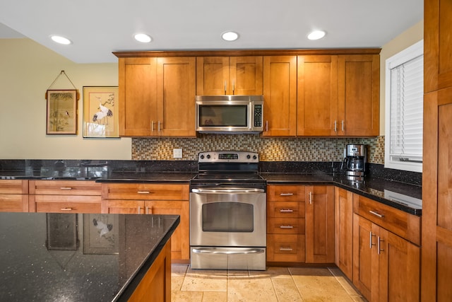 2370 Hoohu Rd Unit 712, Koloa, HI 96756 - kitchen with stainless steel appliances, tasteful backsplash, brown cabinetry, dark stone counters, and recessed lighting