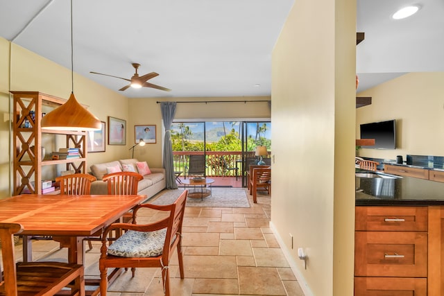 2370 Hoohu Rd Unit 712, Koloa, HI 96756 - dining area with stone tile flooring, ceiling fan, and baseboards