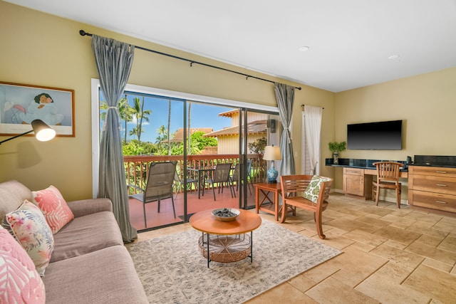 2370 Hoohu Rd Unit 712, Koloa, HI 96756 - living room with stone tile floors and a desk