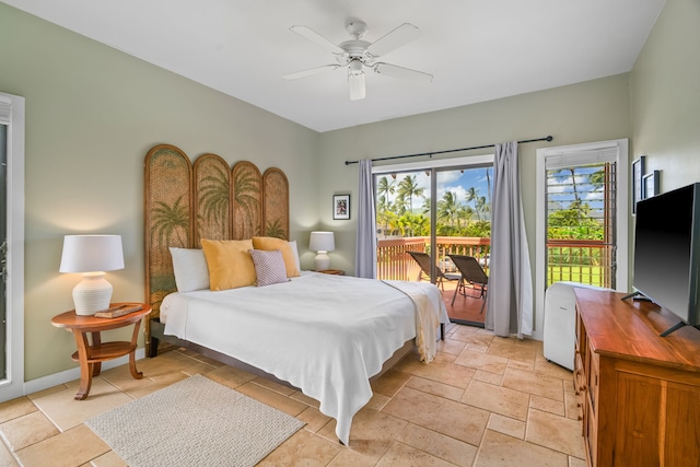 2370 Hoohu Rd Unit 712, Koloa, HI 96756 - bedroom with access to exterior, stone tile floors, and ceiling fan