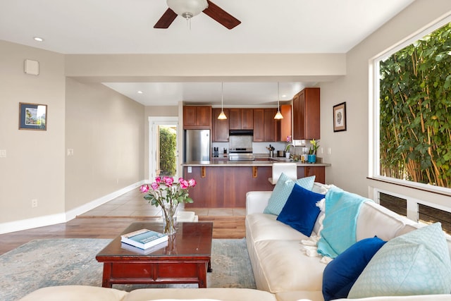 1165 Milia St, Kalaheo, HI 96741 - living room featuring light wood finished floors, baseboards, ceiling fan, and recessed lighting