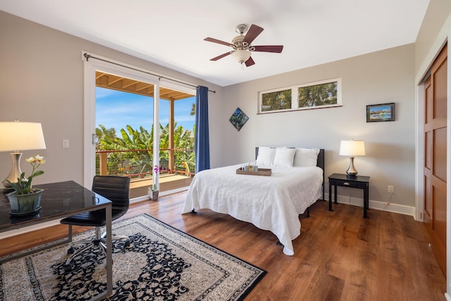 1165 Milia St, Kalaheo, HI 96741 - bedroom featuring access to exterior, wood finished floors, baseboards, and ceiling fan