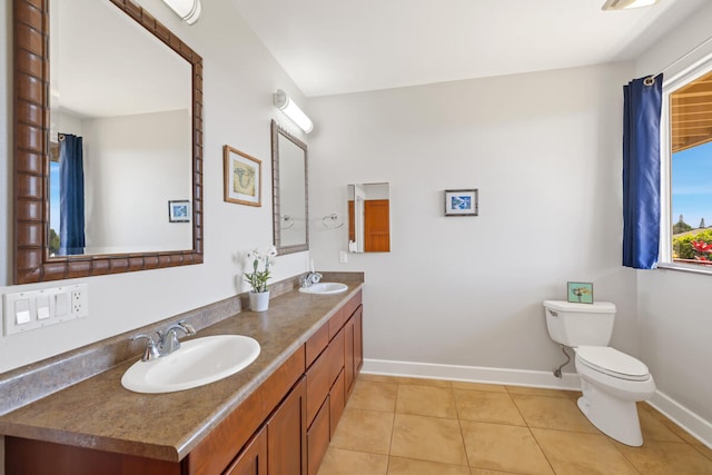 1165 Milia St, Kalaheo, HI 96741 - bathroom with toilet, baseboards, double vanity, and tile patterned floors
