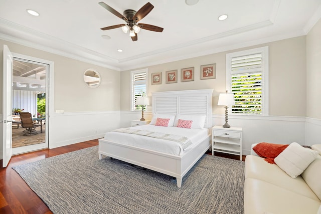 3042 Lauae Pl, Koloa, HI 96756 - bedroom with wainscoting, wood finished floors, access to outside, a raised ceiling, and ornamental molding