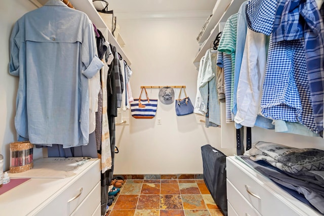 3042 Lauae Pl, Koloa, HI 96756 - walk in closet featuring stone tile flooring